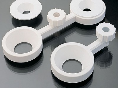 Тримачі для лійок